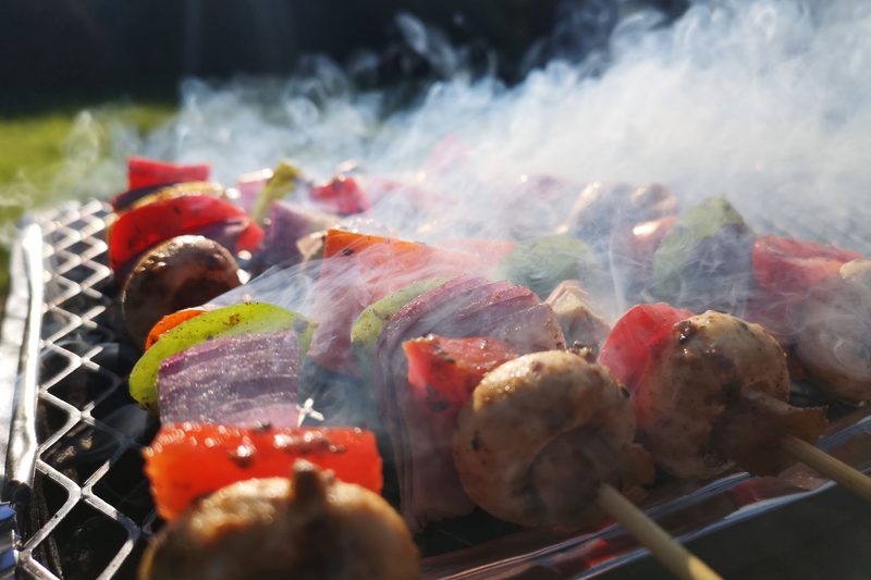 Veggies smoking on a grill