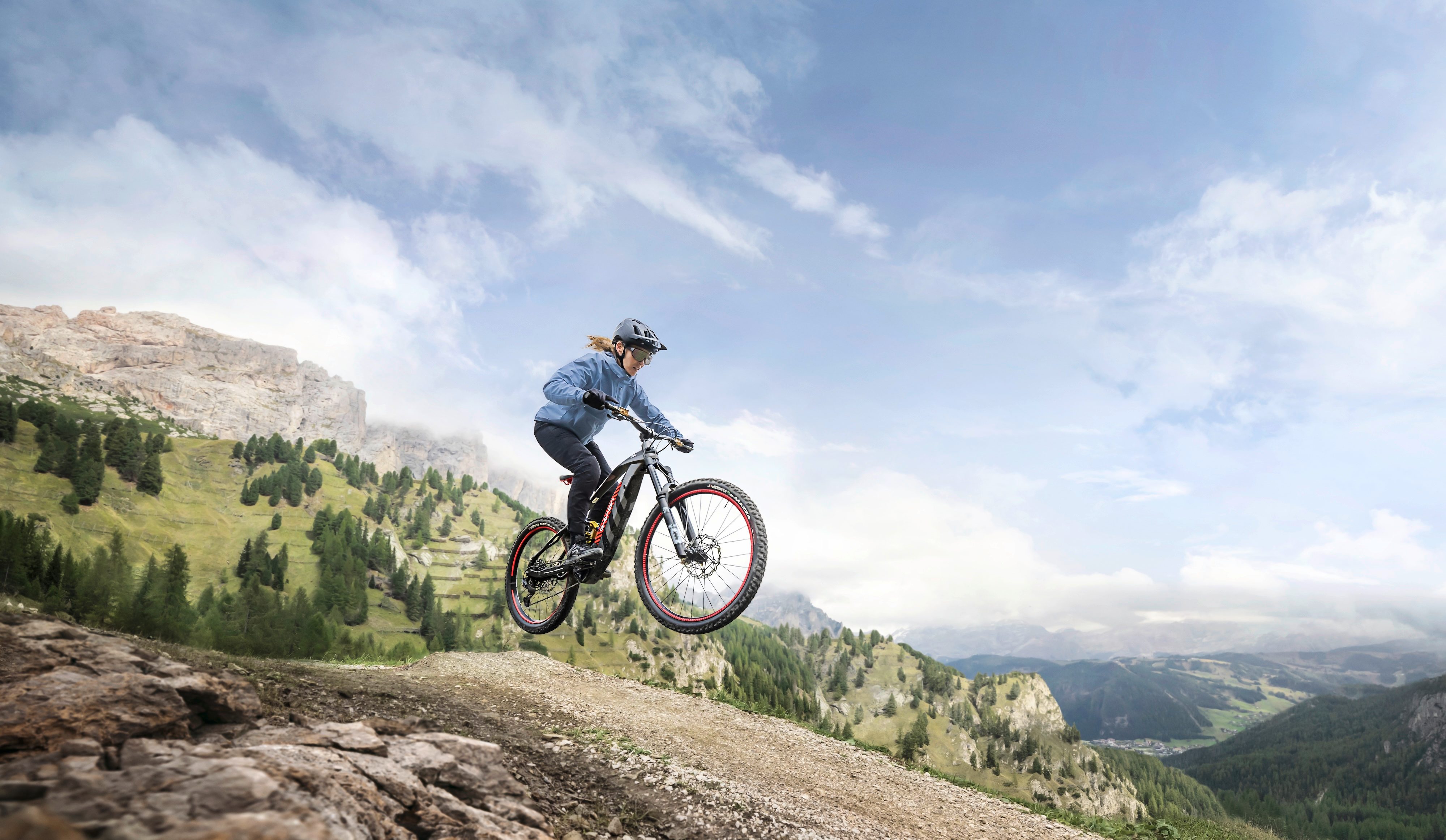 A mountain biker jumping on the new Audi eMTB