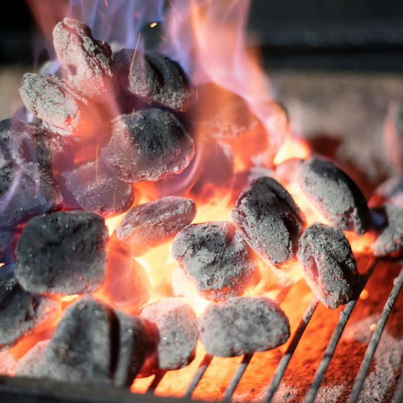 Coals on a hot grill
