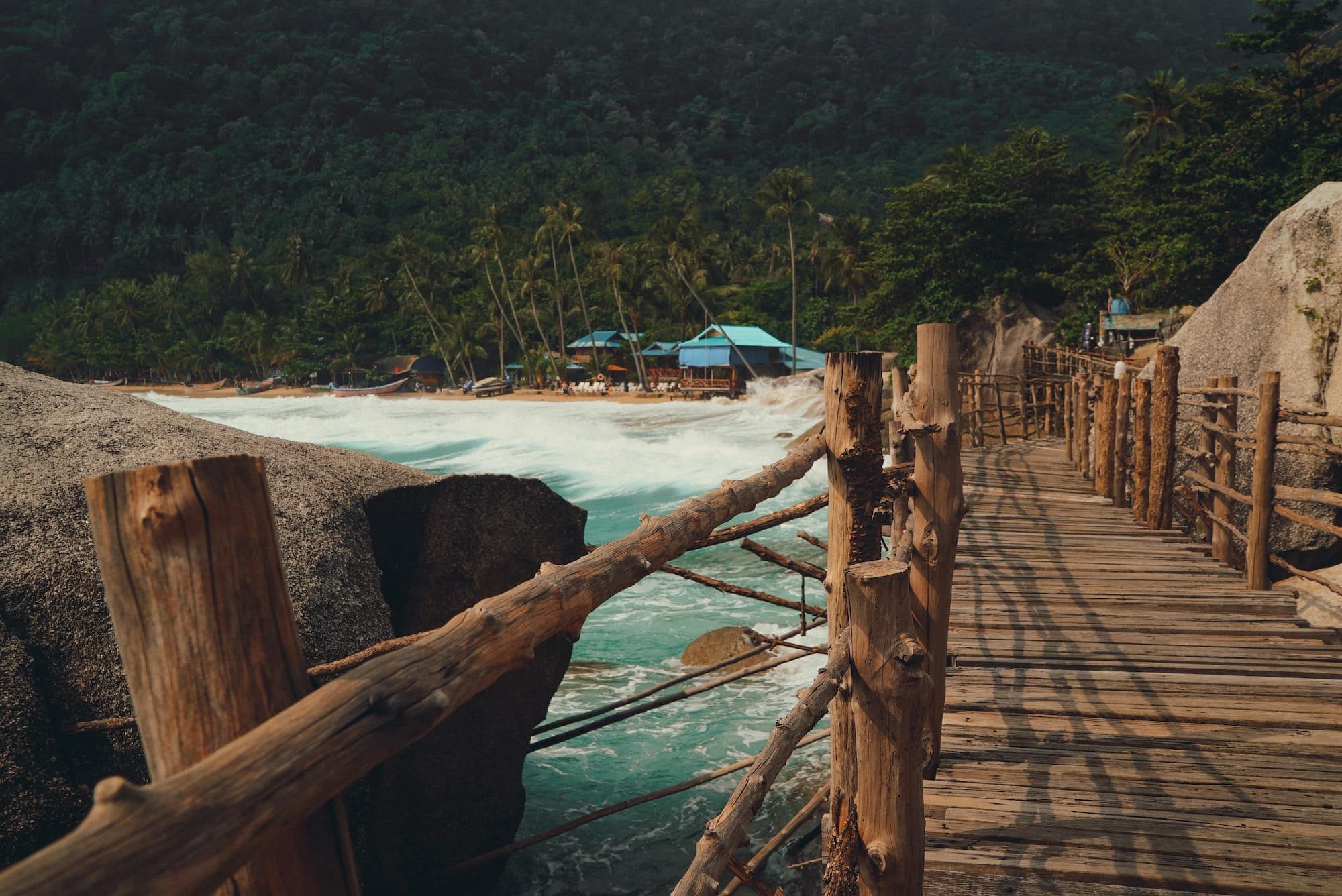 brown wooden bridge in Thailand