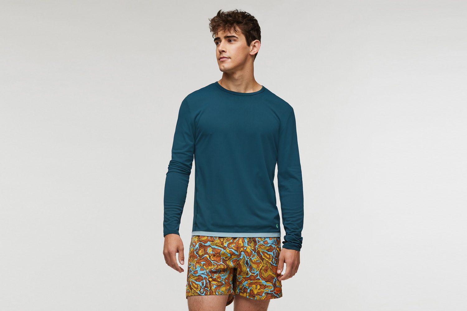 Model wearing Cotopaxi's Sombra Long-Sleeve Sun Shirt.