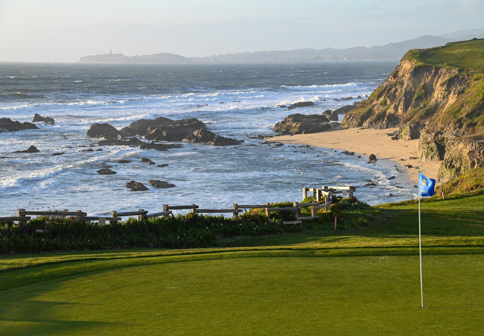 A golf course along the water.
