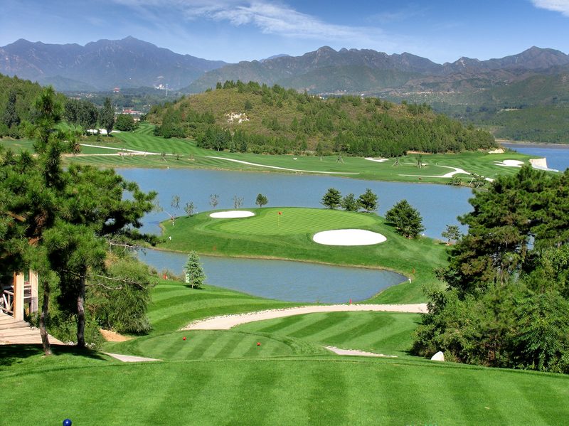 A golf course with water views.