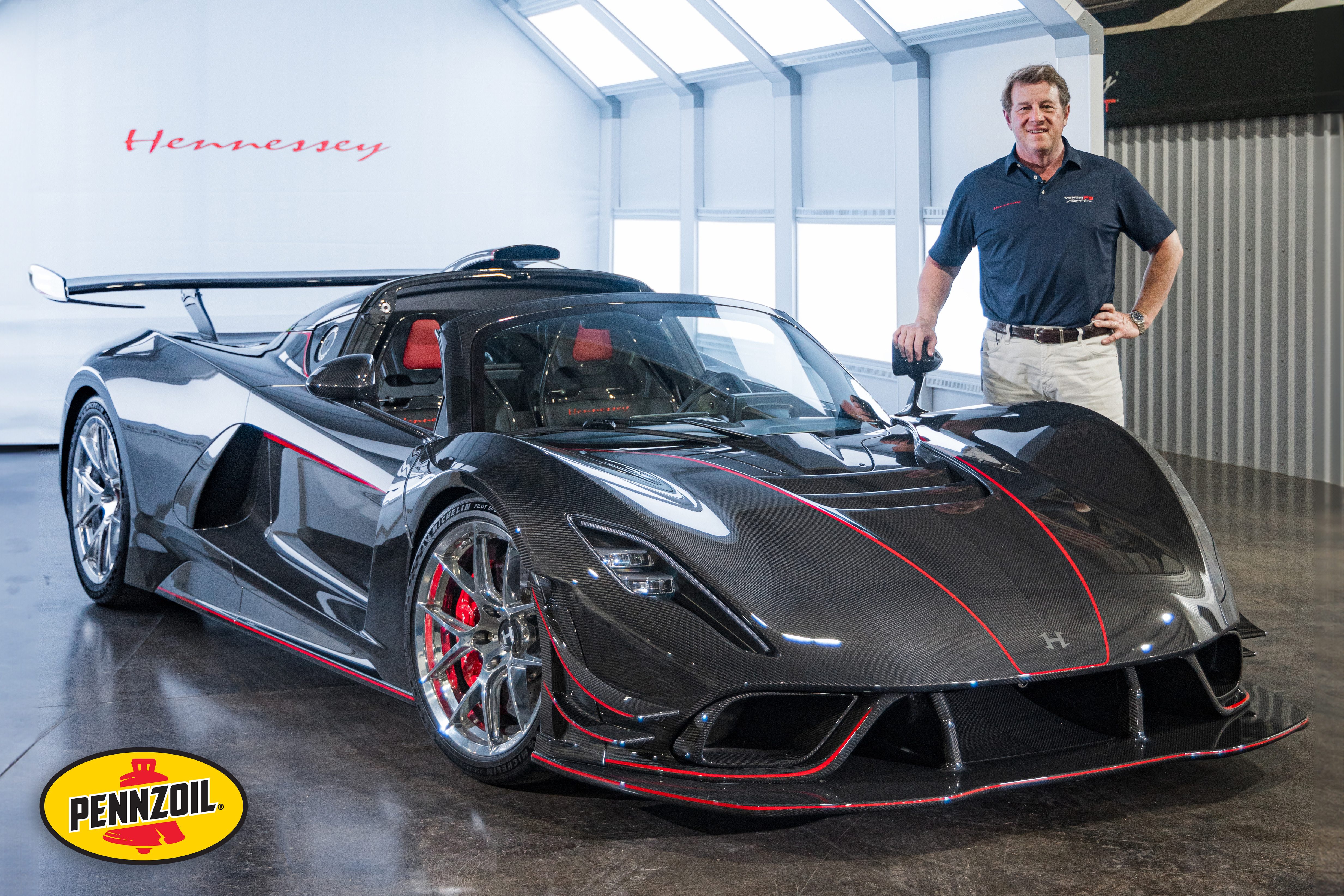 John Hennessey next to a Venom F5