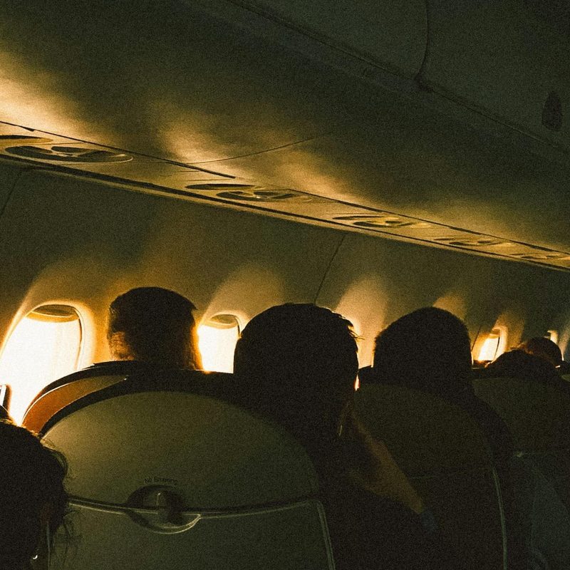 Passengers sitting inside an airplane