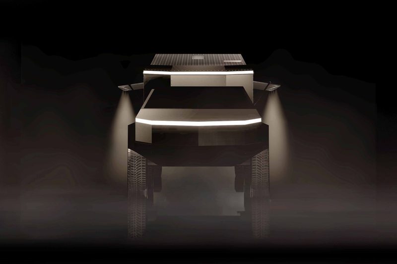 Front view of a Tesla Cybertruck hitched to Living Vehicle's CyberTrailer RV.