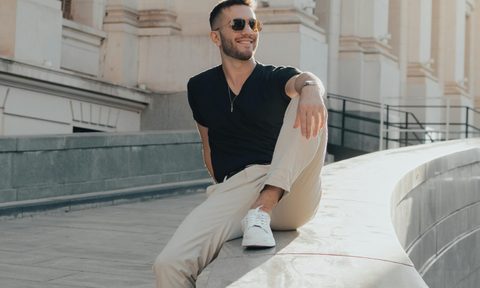 man in black shirt and chinos