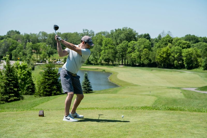 A person about to take a swing at golf.