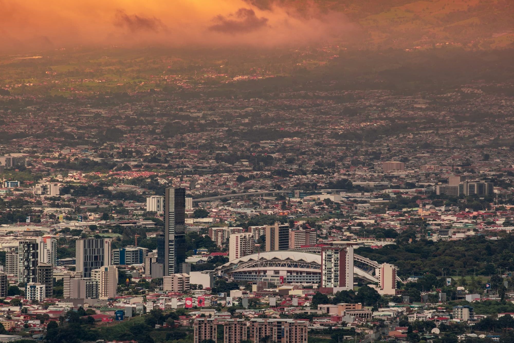 wide view of a city under a cloudy sky