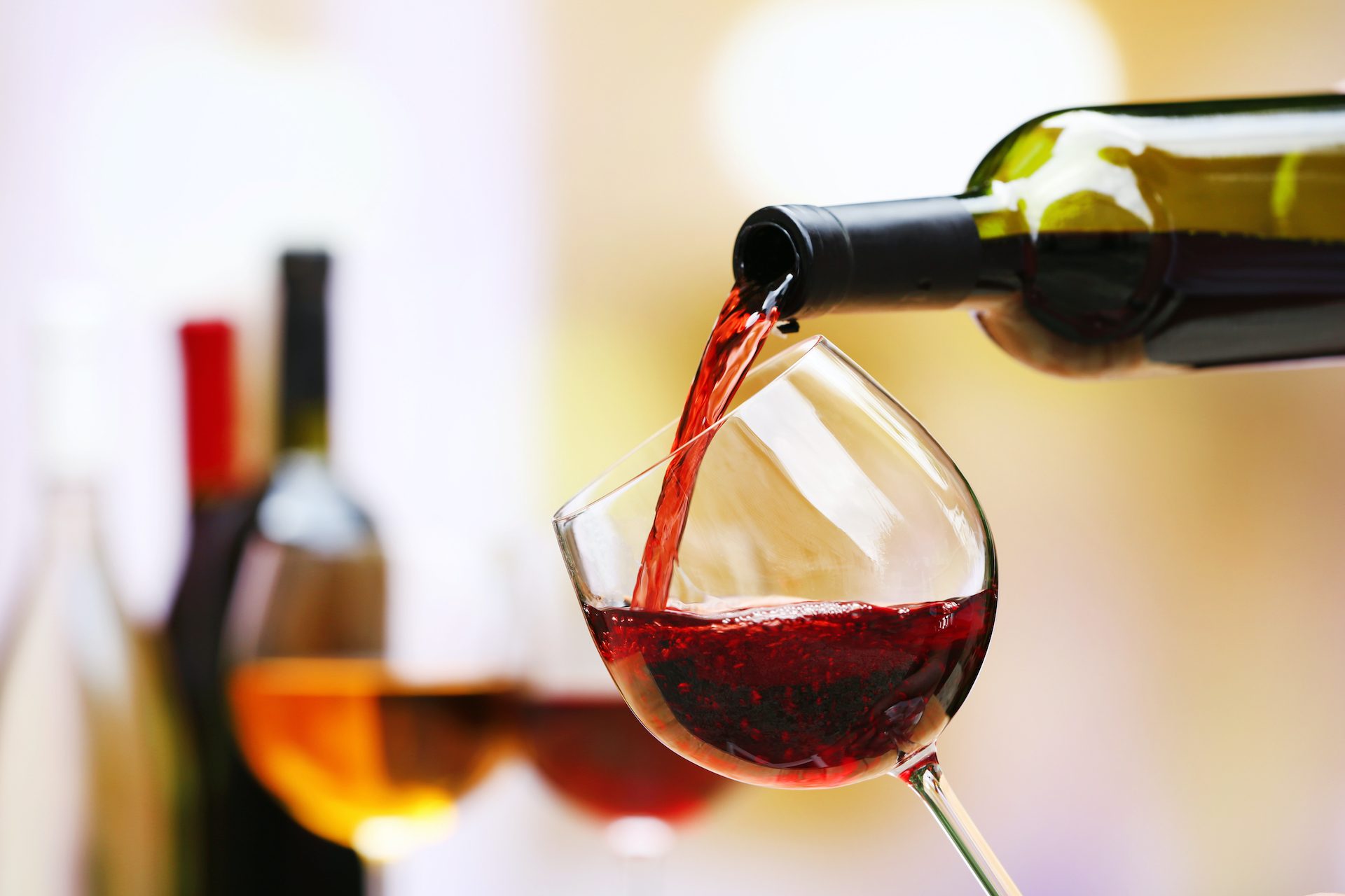 Red wine being poured into a glass