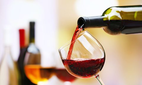 Red wine being poured into a glass