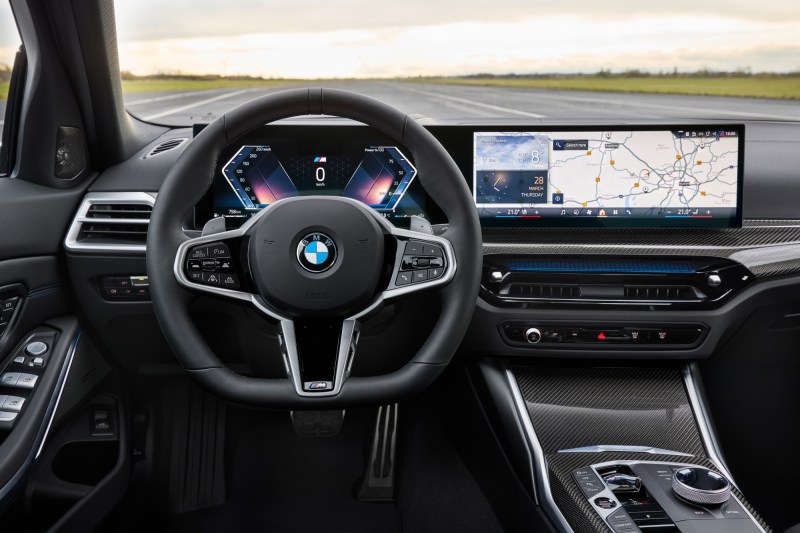 2025 BMW 3 Series interior shot showing driver cockpit and dashboard.