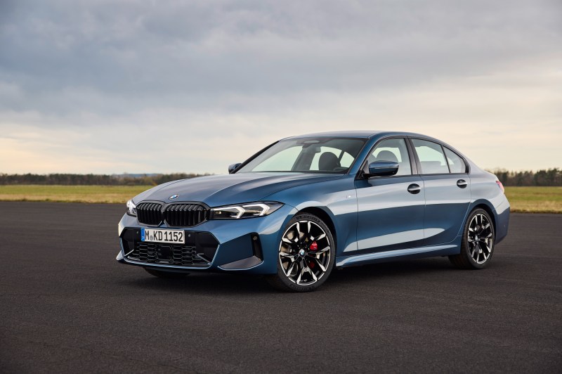 2025 BMW 3 Series left fron three-quarter view parked on an airport runway.