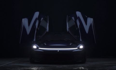 Battista Dark Knight with bat doors open with bats in the background.