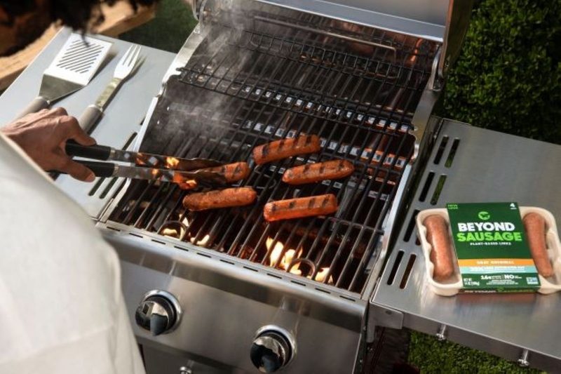 Grilling Beyond Meat sausages.