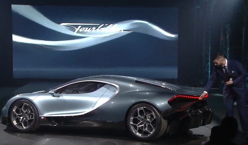 Bugatti CEO Mate Rimac pointing out the Tourbillon's exposed rear wheels.
