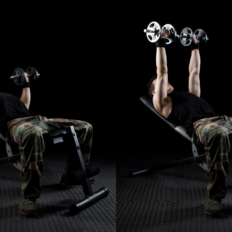 Man doing incline dumbbell press.