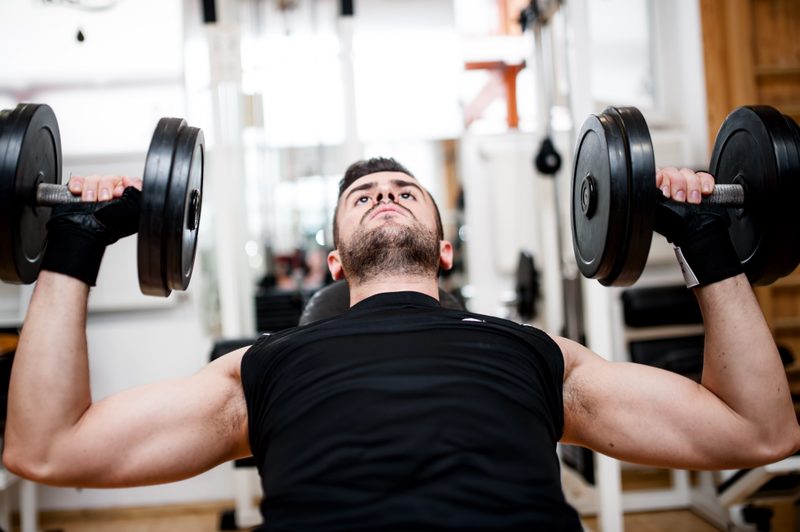 Man doing incline dumbbell press.