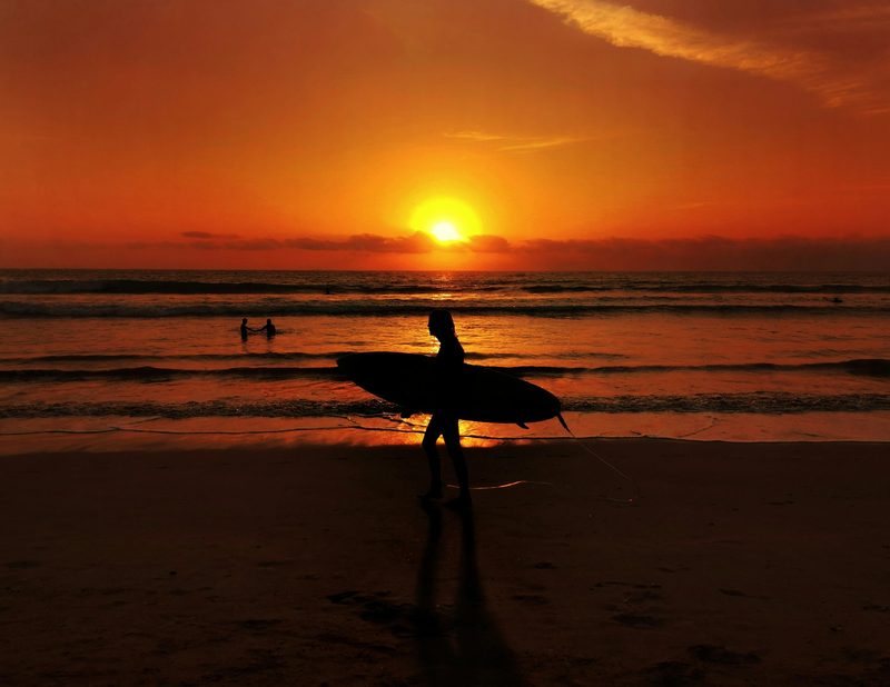 Sunset and surfers in Bali