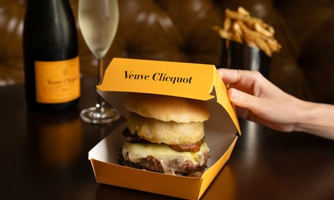 burger in yellow takeout box