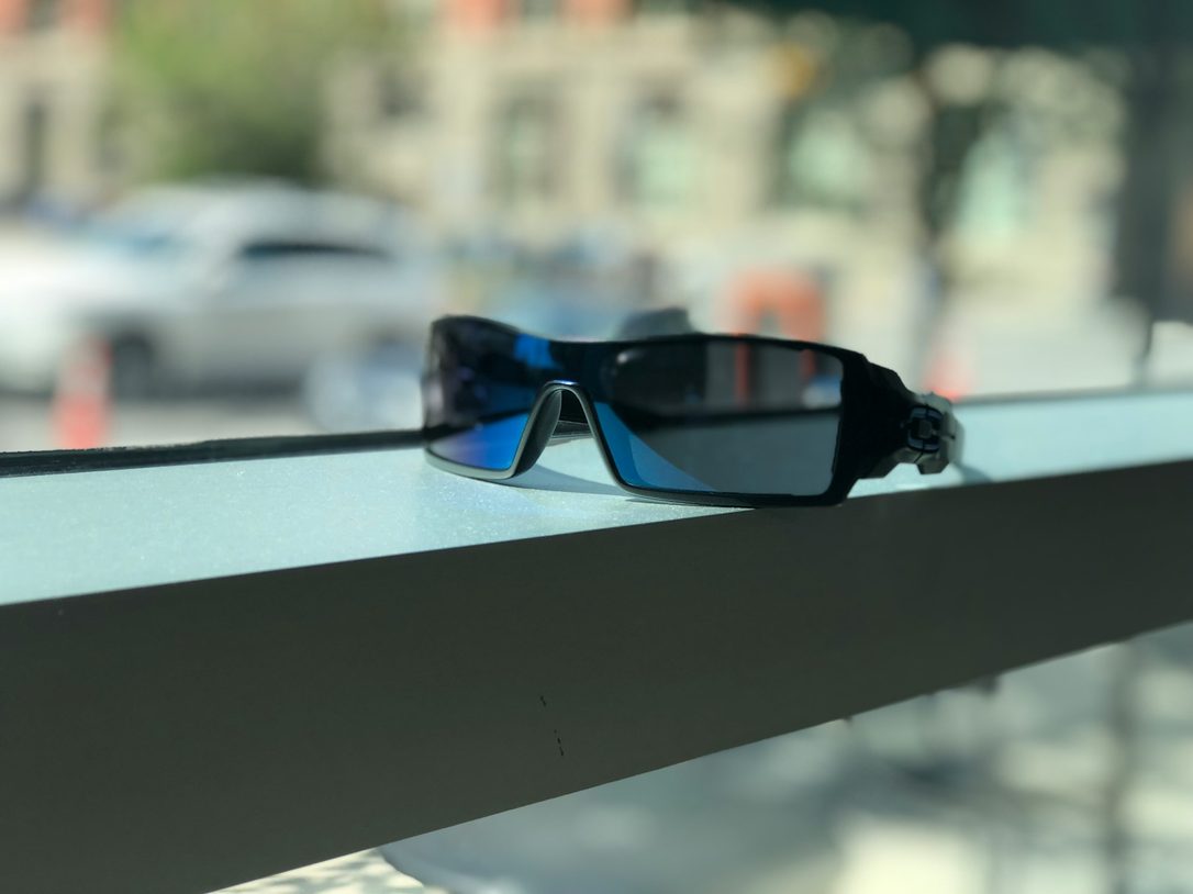 wraparound sunglasses sitting on ledge