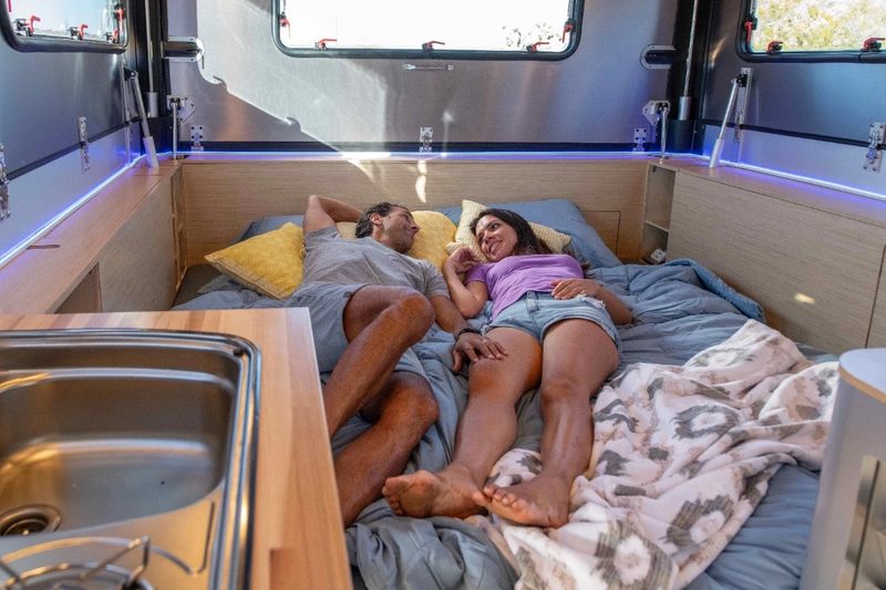 Interior sleeping quarters of the Exodus Capax travel trailer.