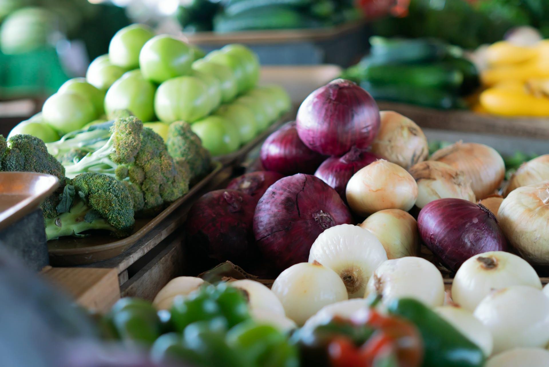 fresh vegetables on table at an outdoor market