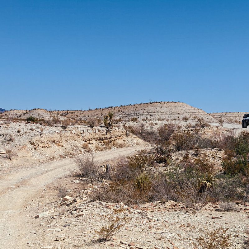 2023 Ford Bronco Raptor driving River Road in Texas' Big Bend National Park.