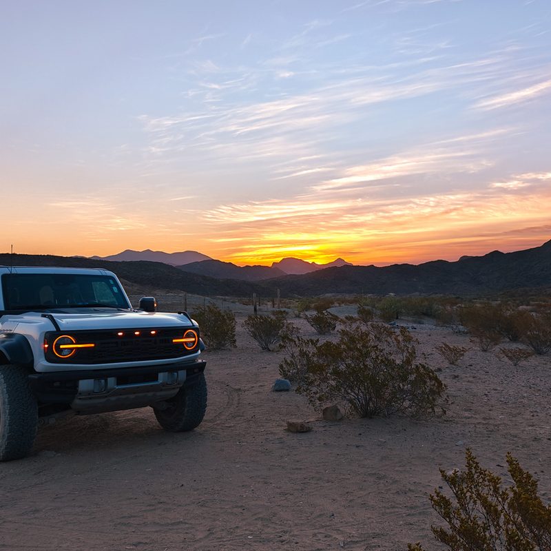 A 2023 Ford Bronco Raptor at sunrise in Terlingua, Texas.