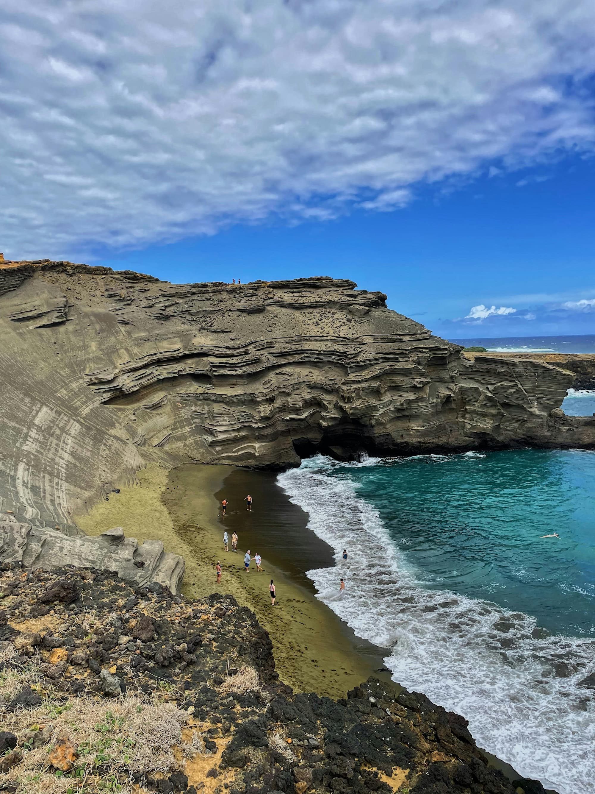 cliffs on the papakolea green sand beach in hawaii