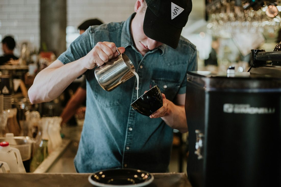 barista making coffee
