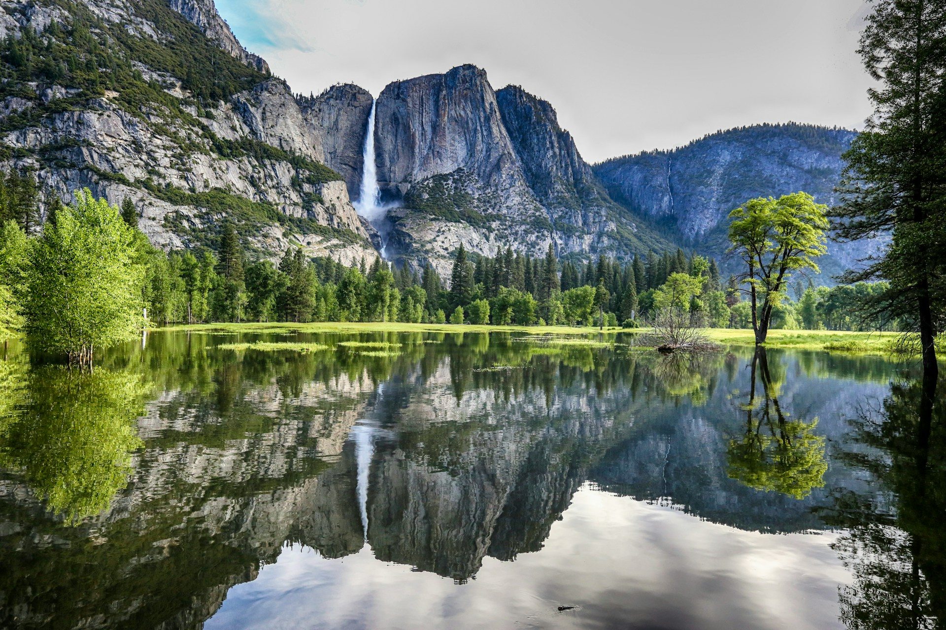 Yosemite park on a warm day, featuring a waterfall