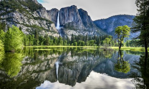 Yosemite park on a warm day, featuring a waterfall