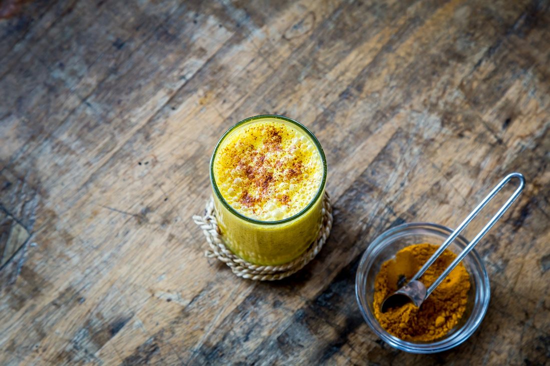 golden milk sitting on table