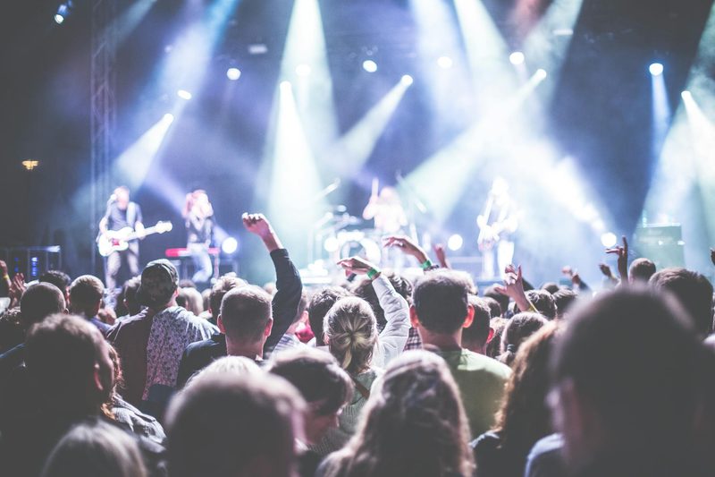 Large crowd with musicians on stage