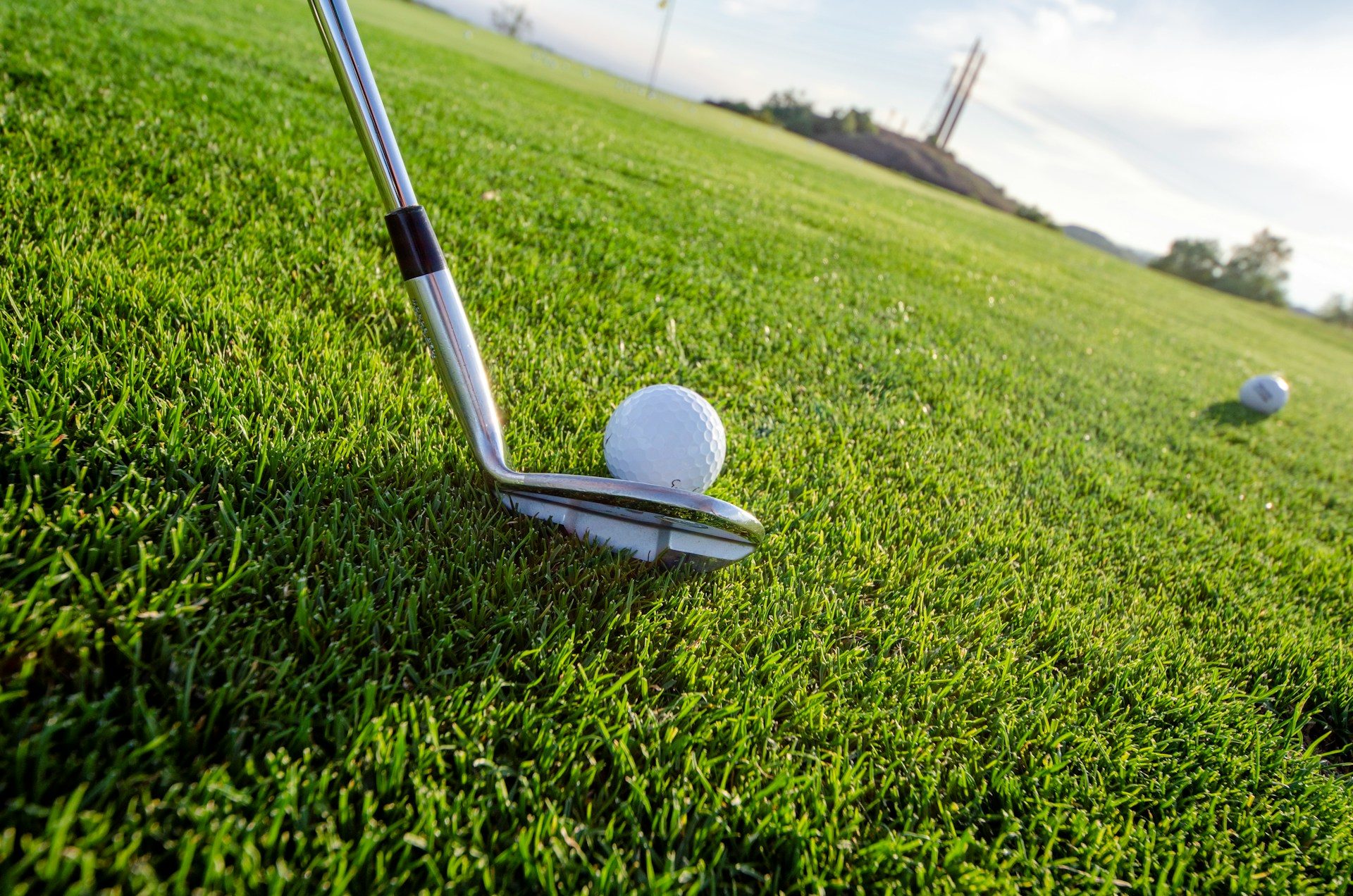 Someone about to hit a golf ball.
