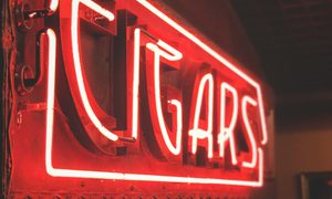Red Neon Sign signaling cigar bar.