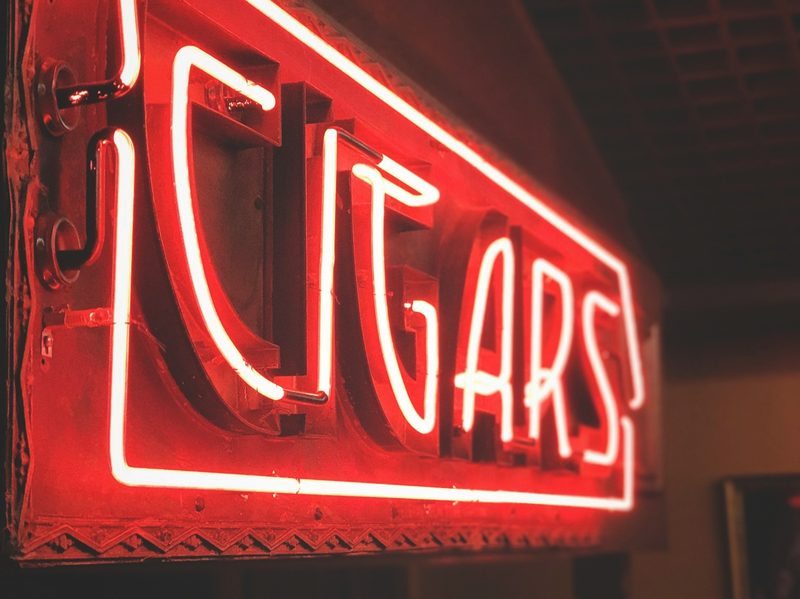 Red Neon Sign signaling cigar bar.