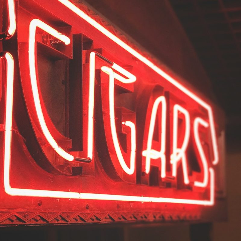 Red Neon Sign signaling cigar bar.