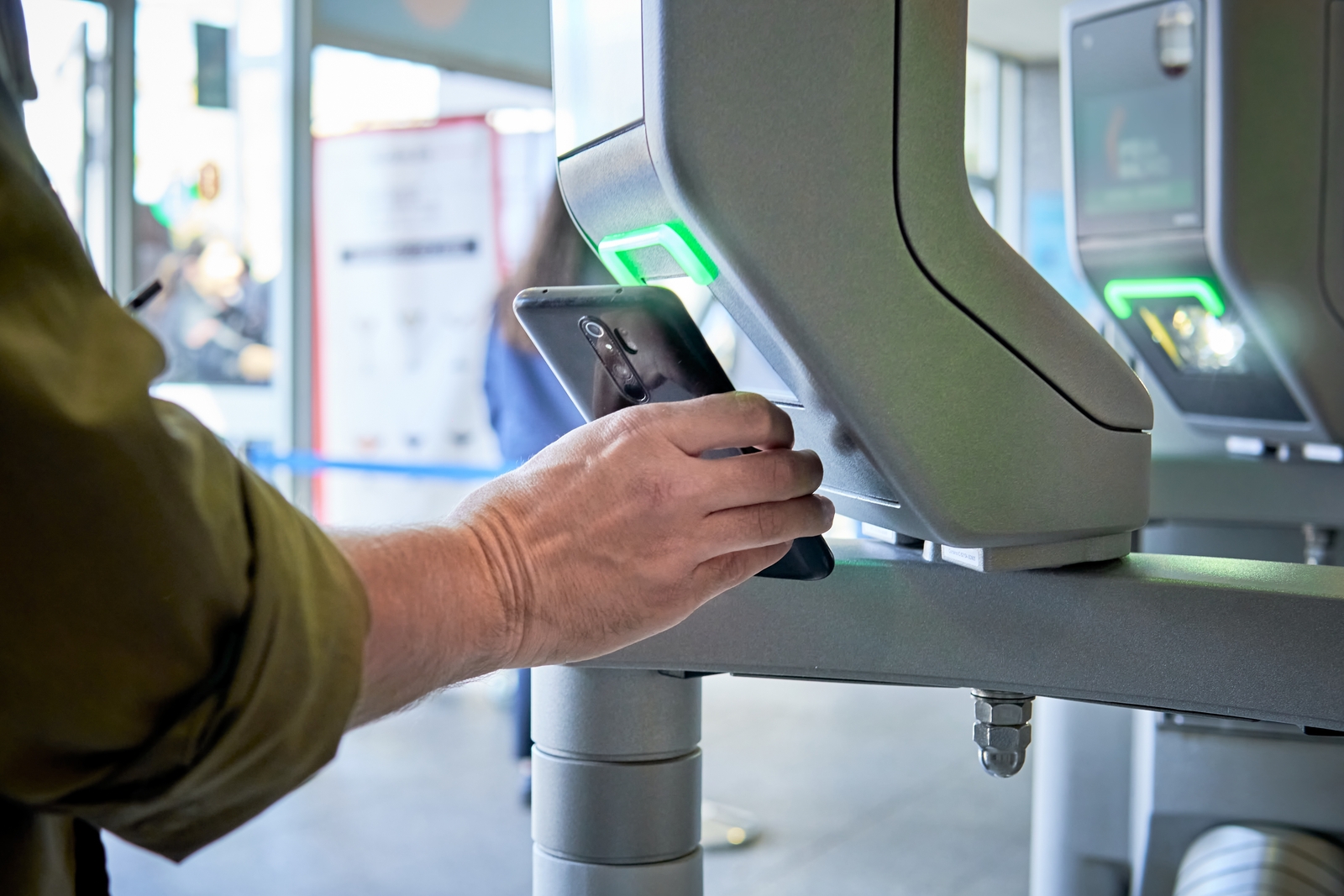 Person scanning QR code at airport