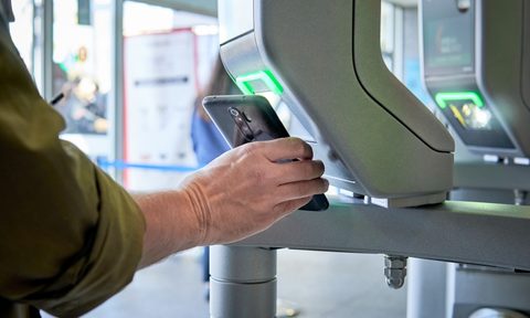 Person scanning QR code at airport