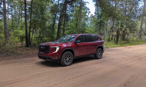 GMC Acadia on a dirt road