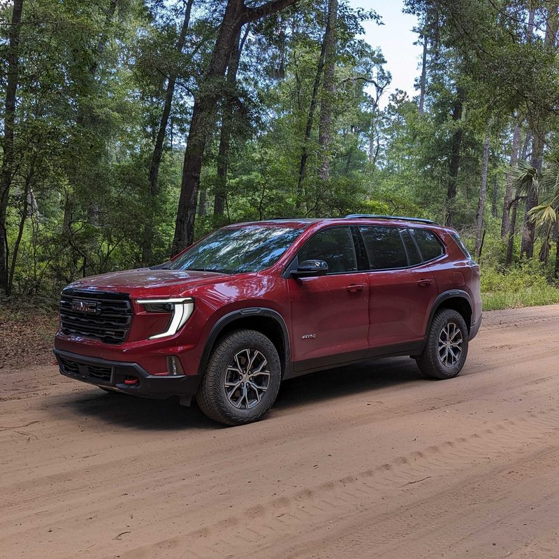 GMC Acadia on a dirt road