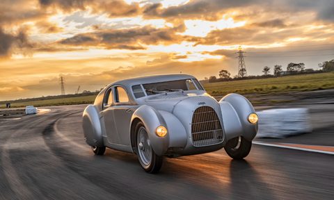 2023 Audi Schnellsportwagon image driving on a curved road.