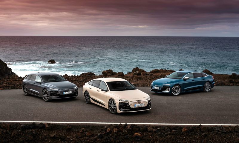 2025 Audi A6 e-tron, A6 e-tron Sportback, and S6 e-tron parked by the ocean.