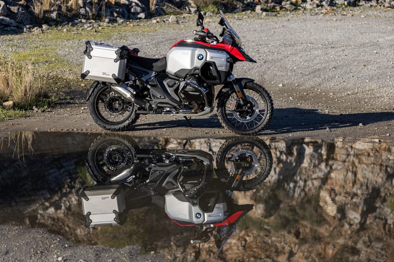 2025 BMW R 1300 GS Adventure parked by reflective water.