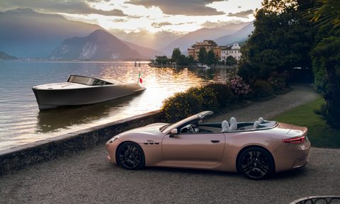 A Maserati GranCabrio Folgore in the foreground with a Maserati TRIDENTE luxury all-electric power boat on Lake Maggiore.