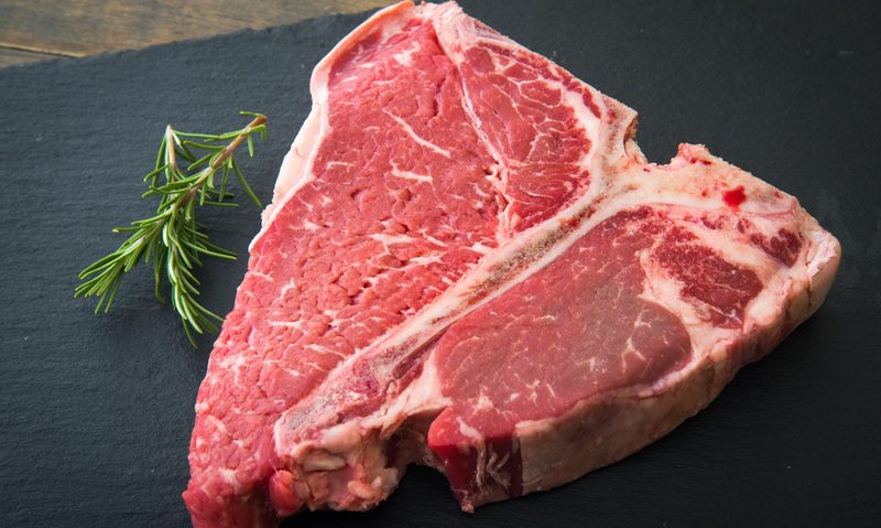 Raw Porterhouse steak