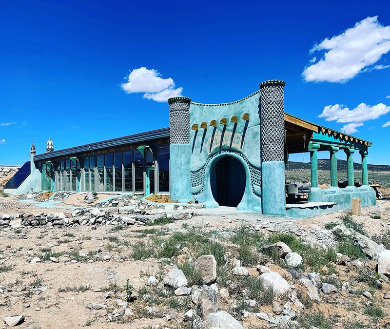 A turquoius earthship available for rent