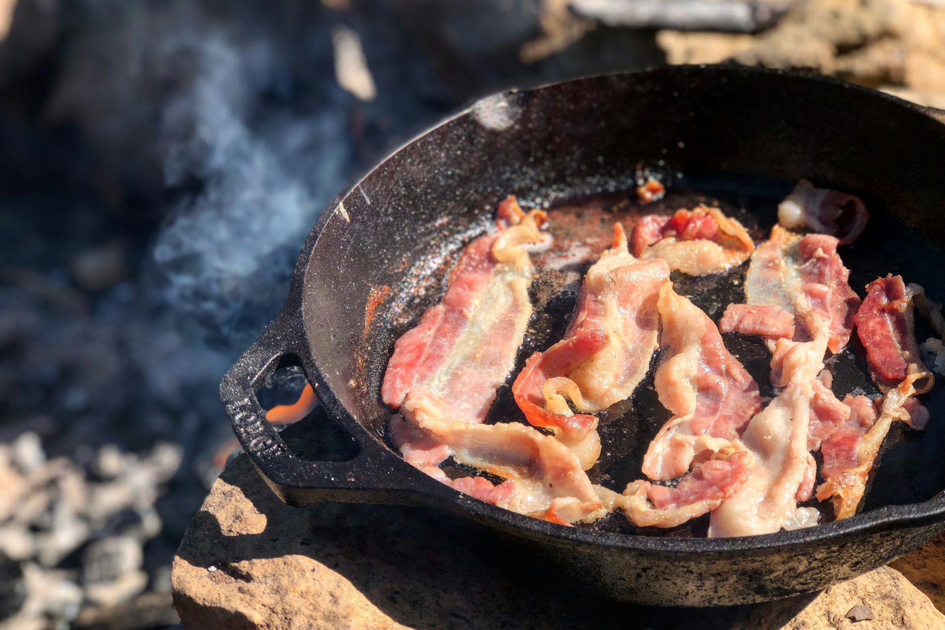 Bacon cooking a cast iron pan